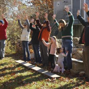 Audience members dance along with Gillman, becoming trees with their arms up.