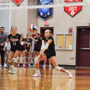 Lucy Lombard returns the ball.