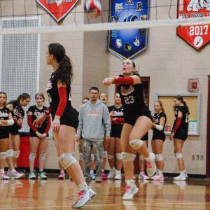 Carly Mello returns a serve with a bump.