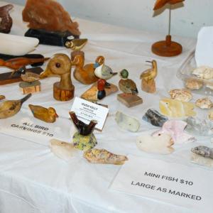 Hugh Kelly uses rocks and wood to craft items. 