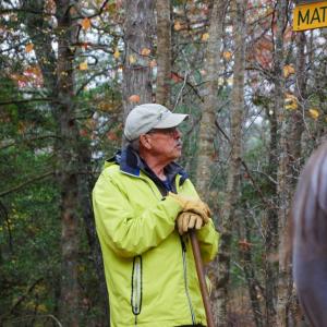 Mike Hugenin is the president of Mattapoisett Land Trust and joined the group for a hike, sharing facts about the area. 