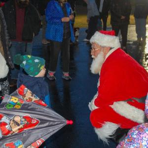 Santa says hello to children.
