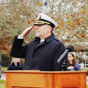 Town Administrator and Navy veteran Geoffrey Gorman salutes the flag as the pledge of allegiance is recited. Photos by Grace Ann Natanawan
