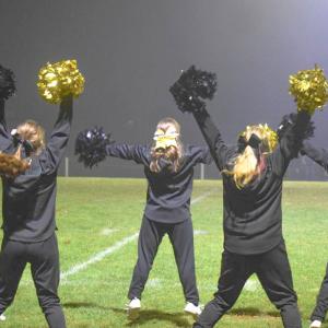 The cheerleaders cheer.