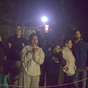 The crowd cheers for a touchdown. 