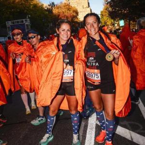 Pease after crossing the finish line of the NYC Marathon in November of 2024 with her running partner, Kristen Wingate.