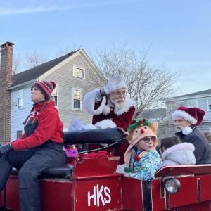 Santa Clause waves at the 2024 Christmas parade. Photo by Brendan Cassidy