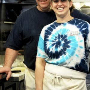 Ken and Liz Ackerman smile in the kitchen of the Oxford Creamery that closed this year. Source: Oxford Creamery Facebook