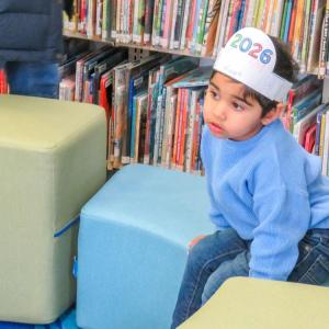Riaan Thakrar, 2, takes a break during the "Noon Year's Eve" celebration. 