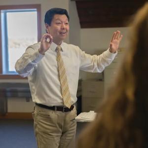 Zhou works as a Director of Choral Music at Tabor Academy. Source: Tabor Academy