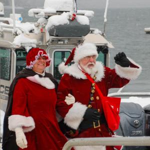 The Clauses greet Marion.