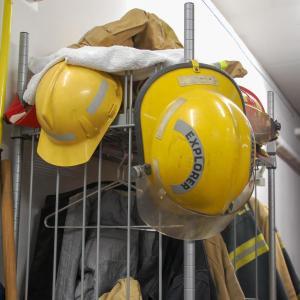 Helmets and equipment are shoved to the side.