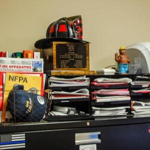 Office spaces are cramped and store many necessities for fire fighters.