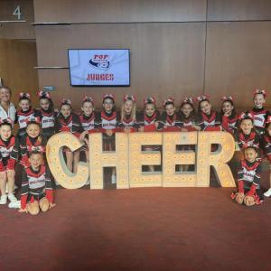 Pee Wee Cheer Team with Coach Jessica Stephens at New England Regionals.