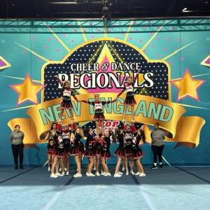 Old Rochester Youth Pee Wee pyramid: Flyers Corey Watlington, Caroline Sadek, and Izzy Waterman. 