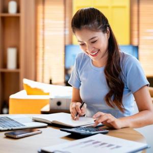 A women creating a budget. 