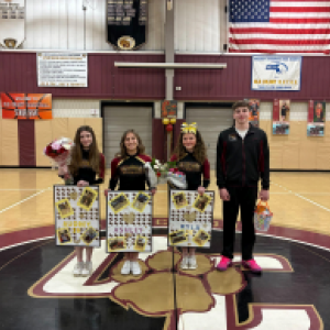 From left: cheerleaders Audrey Perkins, Ashley Marsalino and Kyla Troup, and basketball player Ryan Manchester pose together. 