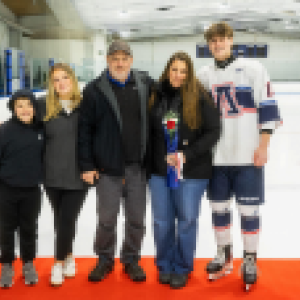 Nate Peck and his family smile together. 