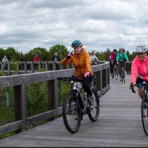 Cyclists smile for the camera at a past Tour de Creme ride. Photo source: Mattapoisett Land Trust