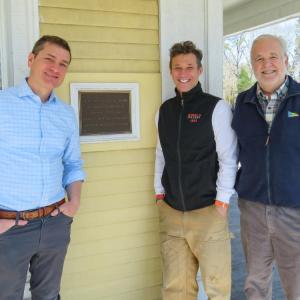 From left: Joshua Fischer, Gerry Riker and Will Tifft stand outside the Captain Hadley House. Photos by Grace Roche