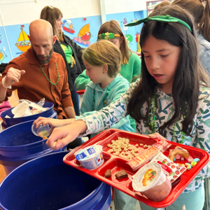 An Old Hammondtown School student sorts through food waste. Photo source: Marion Institute