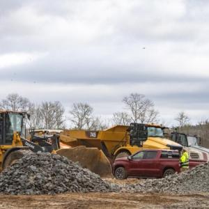 Construction equipment stands ready to build houses at the waterfront development off Route 6 in Marion. Photos by Grace Roche