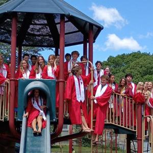 Students pose together on the playground outside Sippican School. 