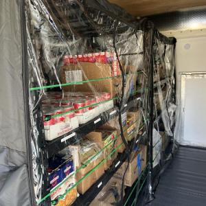 The pantry's shelves are full and ready for shopping. 