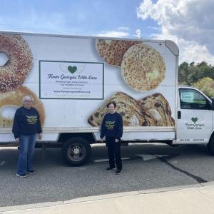 Maureen Vieira, left, and Nora DuPont stand beside the mobile food pantry at the Rochester Council on Aging. Photos by Grace Roche
