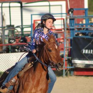 A rider rounds the barrels. Photos by Brandy Muz