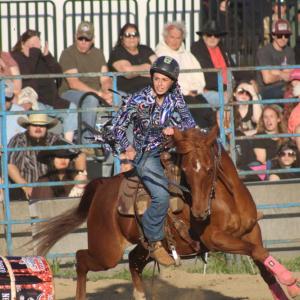A barrel falls during this riders run.