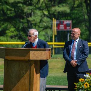 Former Superintendent John Oliveira, left, speaks while current Superintendent Aaron Polansky looks on. 