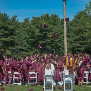 The graduates of the class of 2026 throw their caps in the air at Old Colony's commencement Sunday, May 31. Photos by Grace Roche