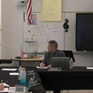 Luis Rivera, left, speaks during a May 7 school committee meeting. Photo source: ORCTV