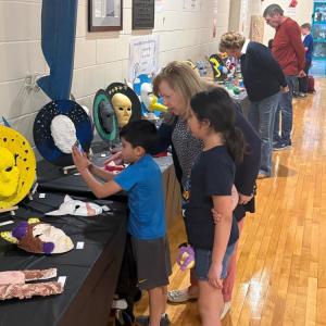 Some of the students displayed masks they made out of plaster. 