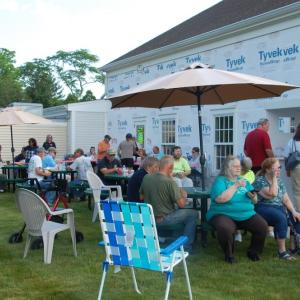 Visitors sat on the lawn and enjoyed refreshments during the car show. 