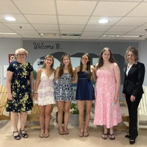 Club President Tara Calabrese and Scholarship Chair Kathy Tibbetts pose with the recipients.