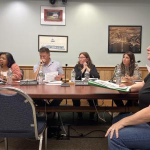 Kathy Abbruzzetti, right, defends her dog during a Tuesday, June 23 Select Board meeting. Photo by Grace Roche