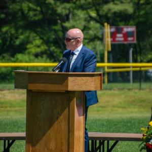 Gary Linehan, principal of Old Colony Regional Vocational Technical High School, speaks at a graduation. Photo by Grace Roche
