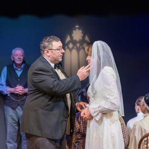 Matt Lynds's character Mr. Webb comforts his daughter Emily. 