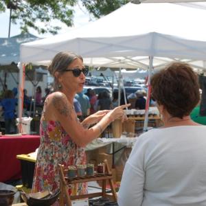 Maureen Starr talks to a customer during Harbor Days at Shipyard Park. Photos by Grace Roche