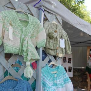 One vendor sold hand-knit clothing. 