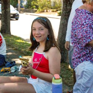 Zola Campbell, 11, holds the trophy her family won for their decorated convertible. 