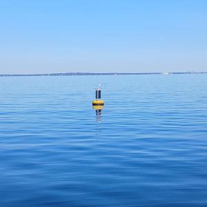 An offshore wave buoy floats off the coast of Mattapoisett in Buzzards Bay. Photo source: Stone Living Lab.
