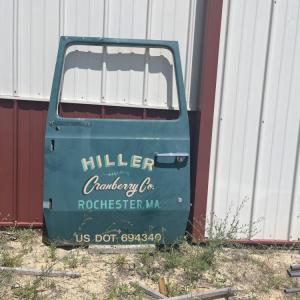 A car door from a now-closed cranberry farm sits on the property. 