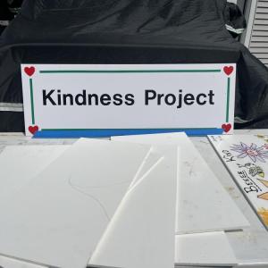 A table on Stan Bradford's property offers boards for people to decorate and return for his Kindness Project. Photos by Grace Roche