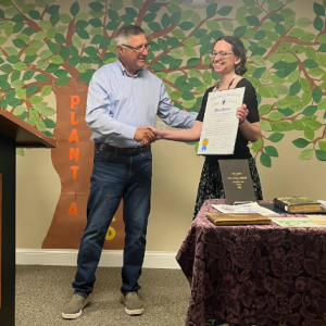 Senator Michael Rodrigues presents a certificate to Cardoso from the state senate. Photo by Tanvi Kulkarni