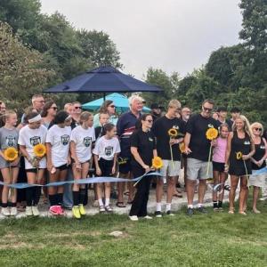 The Eitas family, surrounded by Madelyn's friends and soccer community, cut a ribbon to open Maddie's Circle at the Mariner Youth Soccer Complex on Friday, Aug. 28. Photos by Grace Roche