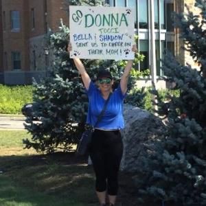 Laura Keegan cheers for Tocci along the course near Boston College in 2017. 