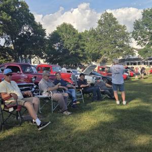 Many folks sat at the park in lawn chairs, listening to music and surrounded by vintage cars.